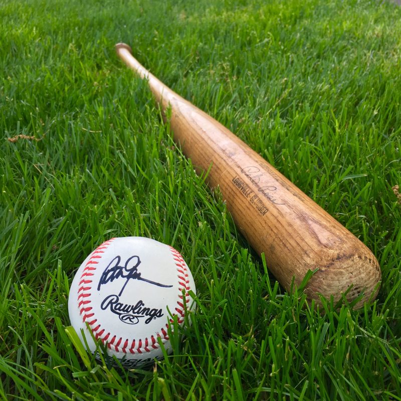 Signed baseball by Peter Gammons and a Louisville Slugger