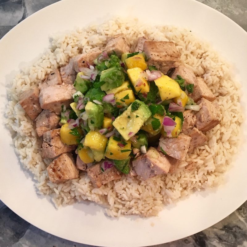 swordfish with mango avocado salsa over a bed of rice