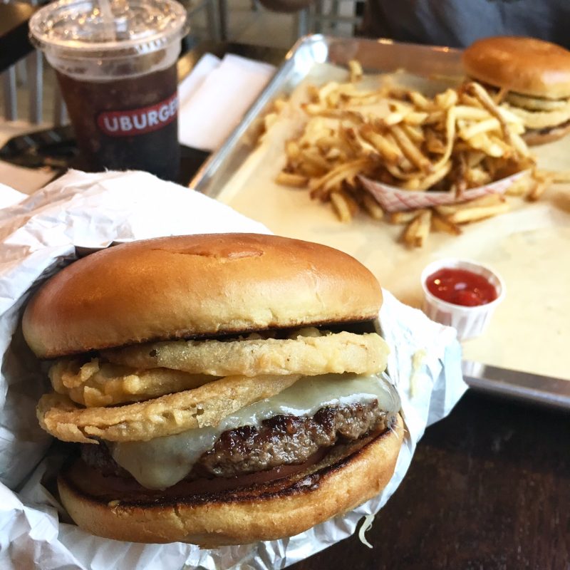burger with onion rings from Uburger