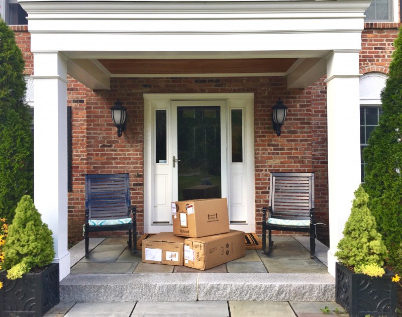 shipping boxes on front doorstep