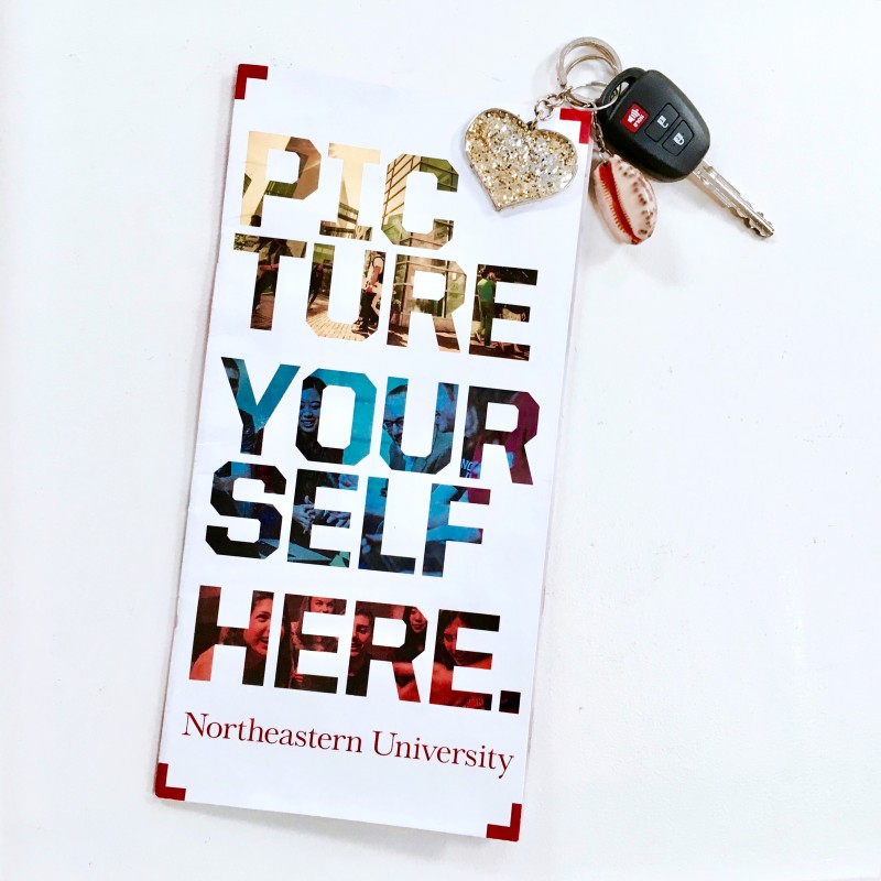 car keys and Northeastern University pamphlet